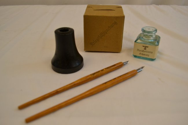 WWII GERMAN MILITARY ISSUED INK PEN WRITING SET: WWII GERMAN MILITARY ISSUED INK PEN WRITING SET . IN NEW , NEVER USED CONDITION. SET OF 3 INK PENS , PEN STAND , INK BOTTLE WITH ORIGINAL CARDBOARD BOX. RARE FIND .