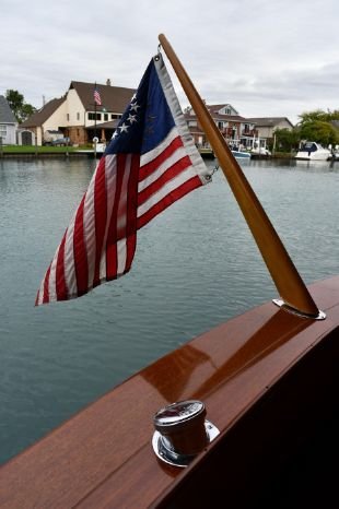 VINTAGE FLAG STAFF FROM GREAT LAKES CHRIS CRAFT CRUISER: MAHOGANY FLAG STAFF ABOUT 48" LONG . COMPLETE WITH BRASS SOCKET AND FLAG HOOKS. SALVAGED FROM MID 1900's GREAT LAKES "CHRIS CRAFT" CRUISER