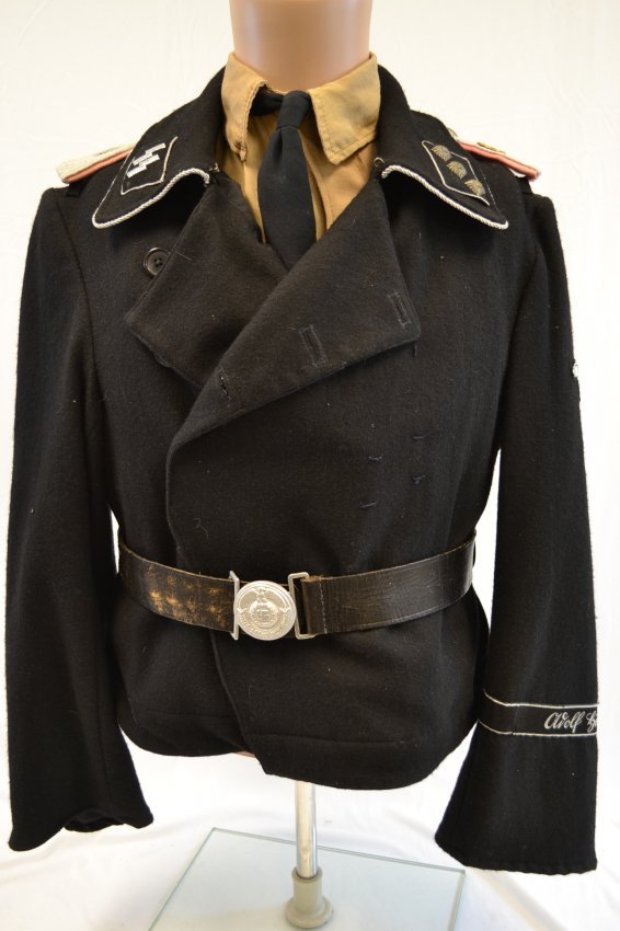 WWII GERMAN PANZER BLACK FIELD JACKET SS OFFICER: WWII GERMAN PANZER BLACK FIELD JACKET SS OFFICER . RUSSIAN MOVIE STUDIO USED JACKET . LOOKS TO BE PUT TOGETHER FROM ORIGINAL AND REPRODUCTION PARTS. VERY NICE JACKET . MOSCOW MOVIE STUDIO STAMPS INSID