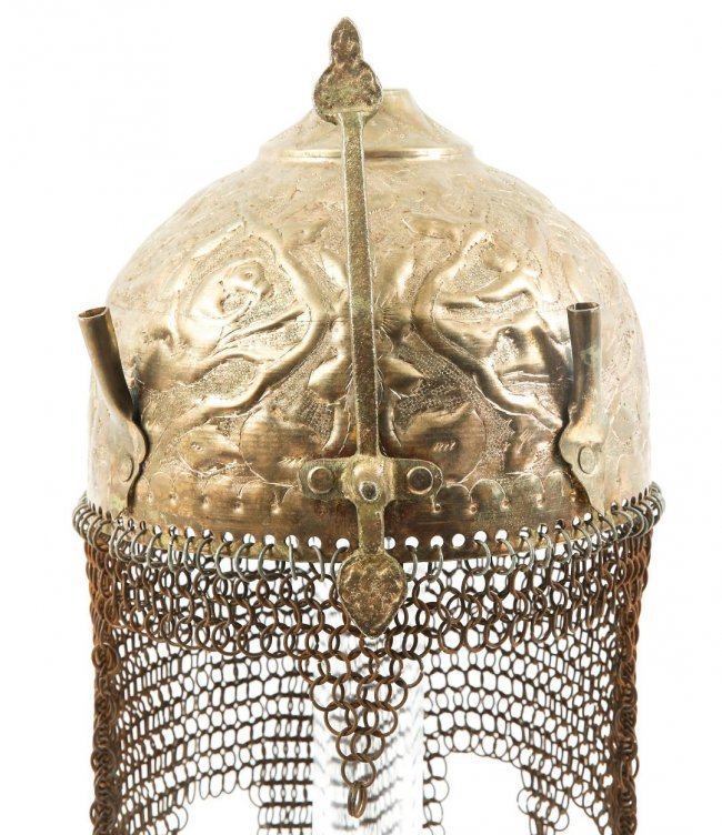 INDO PERSIAN KHULAH KHUD DISPLAY HELMET CHAIN MAIL: INDO PERSIAN KHULAH KHUD DISPLAY HELMET CHAIN MAIL. Engraved with Persian Mughal cavalry repousse in relief. Brass construction with chain mail neck guard. Two plume fittings, pierced top vent.