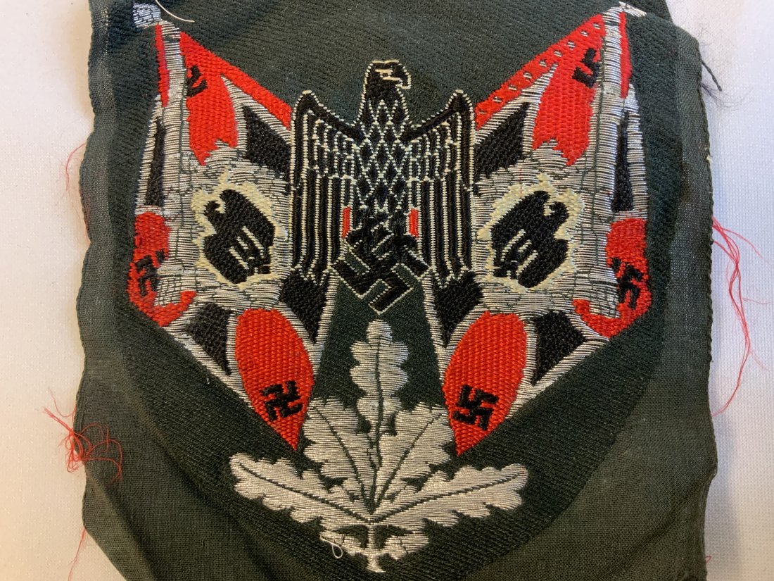 RARE WWII NAZI GERMAN ARMY STANDARD BEARERS PATCH: RARE WWII NAZI GERMAN ARMY STANDARD BEARERS PATCH . IT IS “Bevo” MACHINE WOVEN ON A FIELD GREEN RAYON BACKING MATERIAL . NEVER BEEN USED OR CUT. RED FOR ARTILLERY .