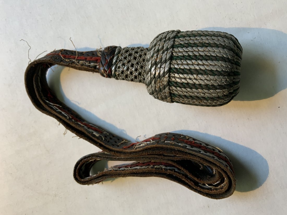 WWII GERMAN LEATHER SWORD / BAYONET POLICE KNOT: WWII GERMAN LEATHER SWORD / BAYONET POLICE KNOT . WELL USED CONDITION. SOME TEARS AND WEAR TO THE STRAP.