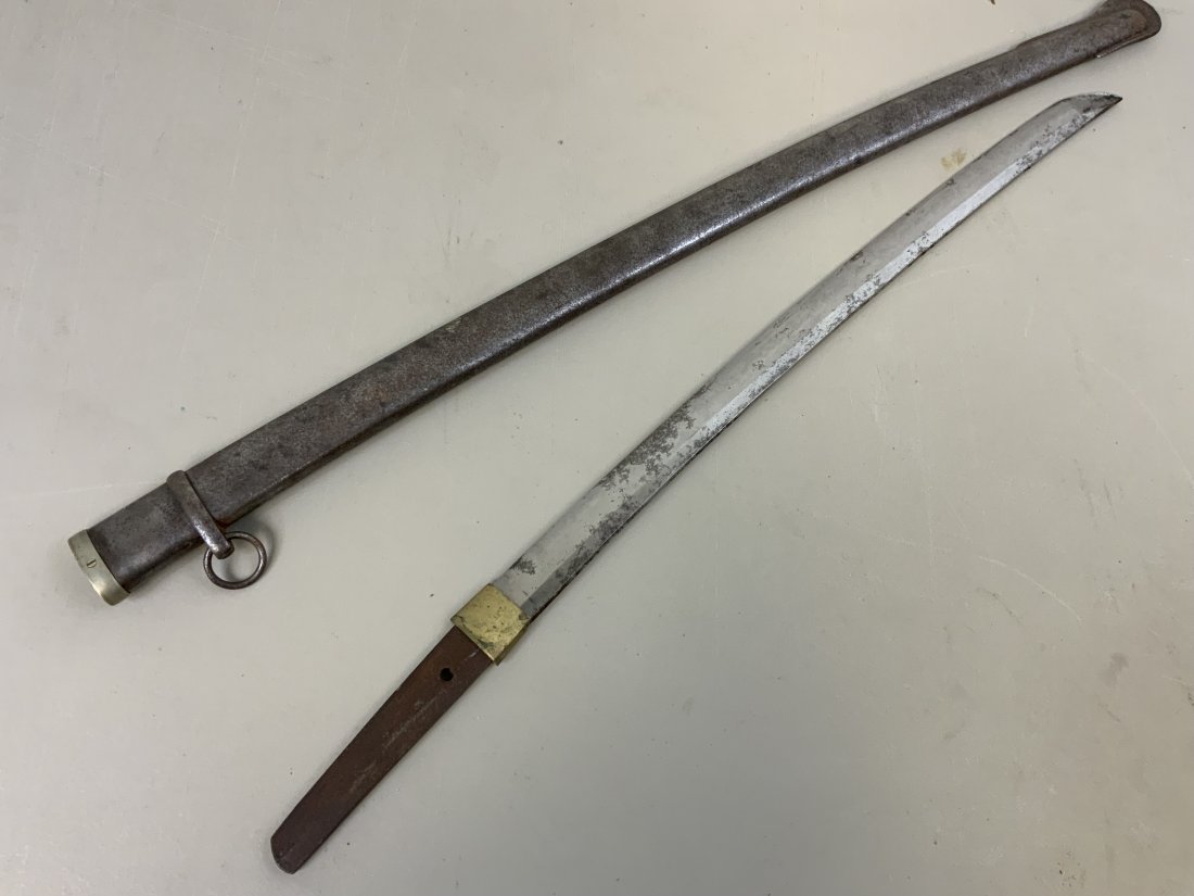 ANTIQUE OLD JAPANESE WAKIZASHI SAMURAI SWORD: ANTIQUE OLD JAPANESE WAKIZASHI SAMURAI SWORD . RELIC CONDITION .BLADE DISPLAY A GREAT AGE WITH WAVY HAMON STILL VISIBLE. METAL SCABBARD FROM EARLY 20TH CENTURY . 30" LONG WITH 18" BLADE.