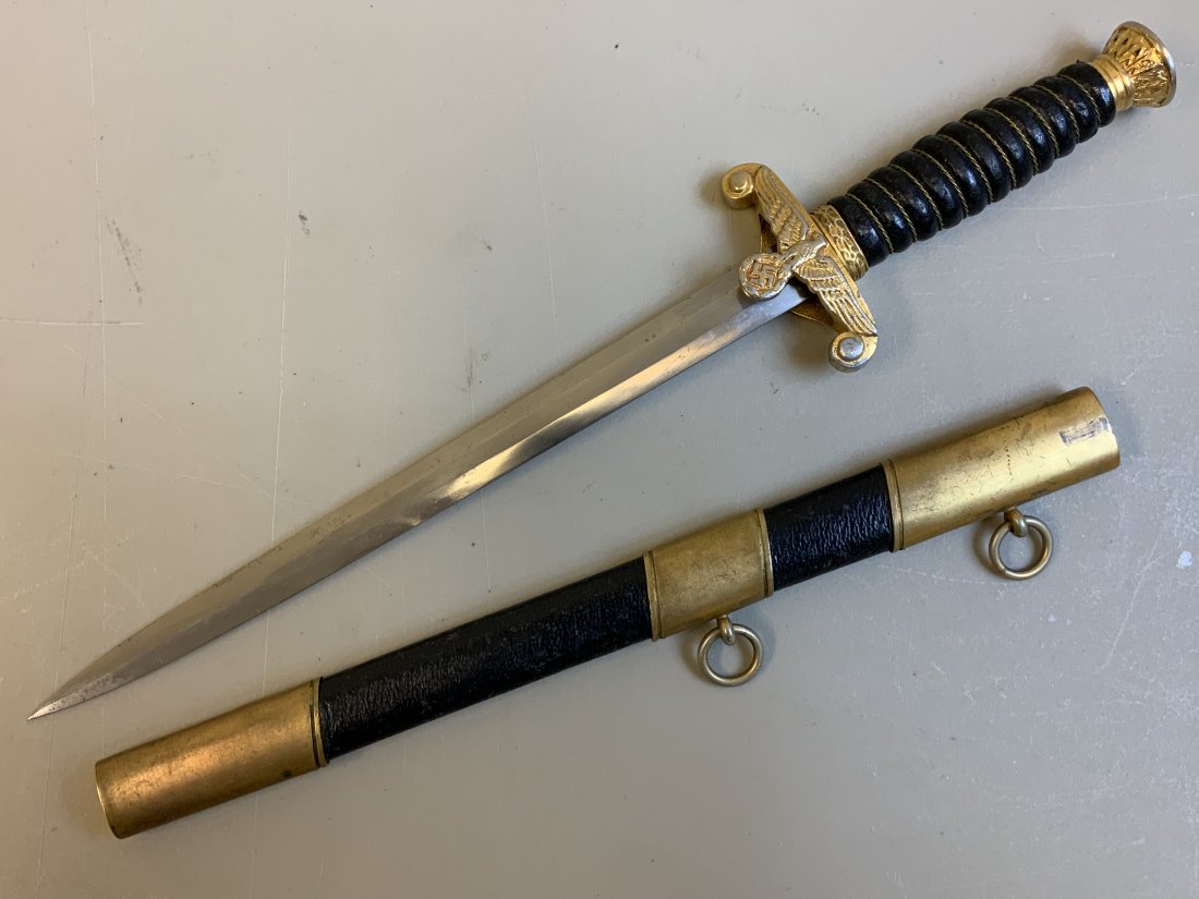 WWII GERMAN WATER CUSTOMS DAGGER QUALITY OLD REPRO: WWII GERMAN WATER CUSTOMS DAGGER . QUALITY OLD REPRODUCTION . NICELY MADE WITH GILDED ALUMINUM FITTINGS AND WKC MARKED BLADE . GREAT FILLER FOR THIS VERY RARE AND HIGHLY DESIRABLE DAGGER.