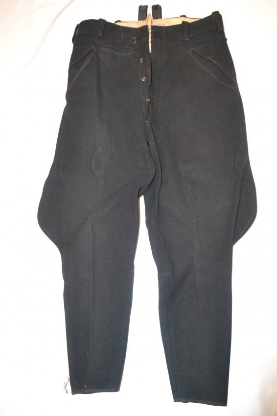 WWII GERMAN ALLGEMEINE SS BLACK UNIFORM BRITCHES PANTS: ALLGEMEINE SS NAZI GERMAN BLACK UNIFORM BRITCHES PANTS . WELL WORN EXAMPLE WITH STAINS INSIDE. NICE VERY HIGH QUALITY MADE WITH METAL ZIPPERS. SS/RZM TAG INSIDE. RARE FIND .