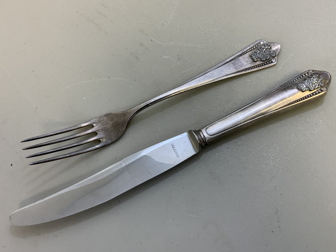 KAISER WILHELM II STERLING SILVER TABLEWARE: TWO PIECE STERLING SILVER , INFORMAL PATTERN AND BOTH BEARING HIS CIPHER ON THE HANDLE. THE KNOFE IS 10" LONG , FORK 8.5" LONG , BOTH HALLMARKED "HF" AND "90" FOR SILVER PURITY.