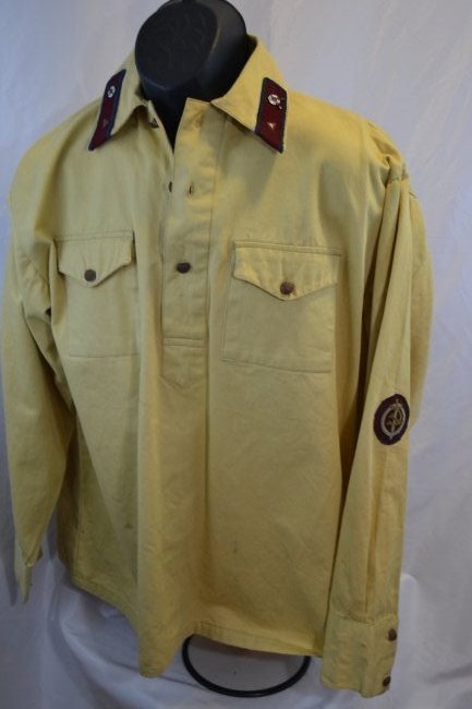 PRE WWII SOVIET RUSSIAN NKVD OFFICER UNIFORM SHIRT: PRE WWII SOVIET RUSSIAN NKVD OFFICER UNIFORM SHIRT .RARE SUMMER WHITE COLOR SHIRT . AGE YELLOWING TO A WHITE MATERIAL . HIGH QUALITY EMBROIDERED NKVD SLEEVE BADGES . M35 PATTERN . RARE.