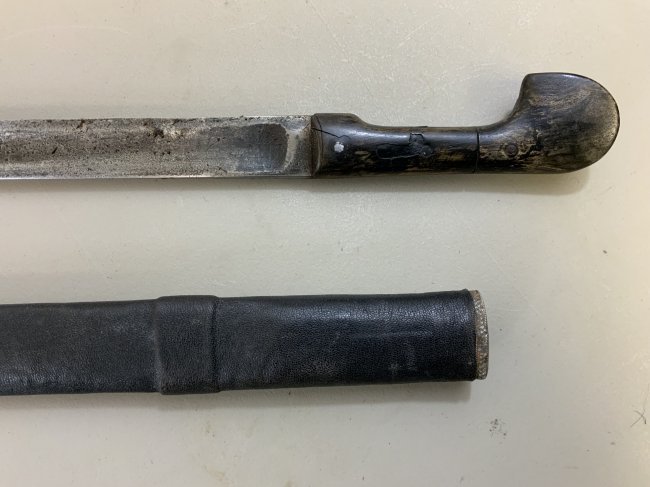 ANTIQUE RUSSIAN CAUCASIAN SHASHKA SWORD SMALL CHILD: ANTIQUE RUSSIAN CAUCASIAN SHASHKA SWORD . 1914 DATED BLADE . 29" LONG WITH 23" BLADE . CUTDOWN OLD BLADE WITH NEWLY MADE SCABBARD. SMALL CHILD SIZE.