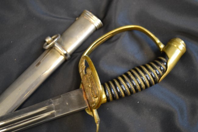 IMPERIAL GERMAN PRUSSIAN SWORD: IMPERIAL GERMAN PRUSSIAN SWORD . NICE BRIGHT BLADE APPEARS TO BE SHORTENED AT THE TIP . NICKEL PLATED SCABBARD TO ACCOMMODATE SHORT SWORD BLADE . GREAT CONDITION OVERALL . 35" LONG WITH 37.5" BLADE