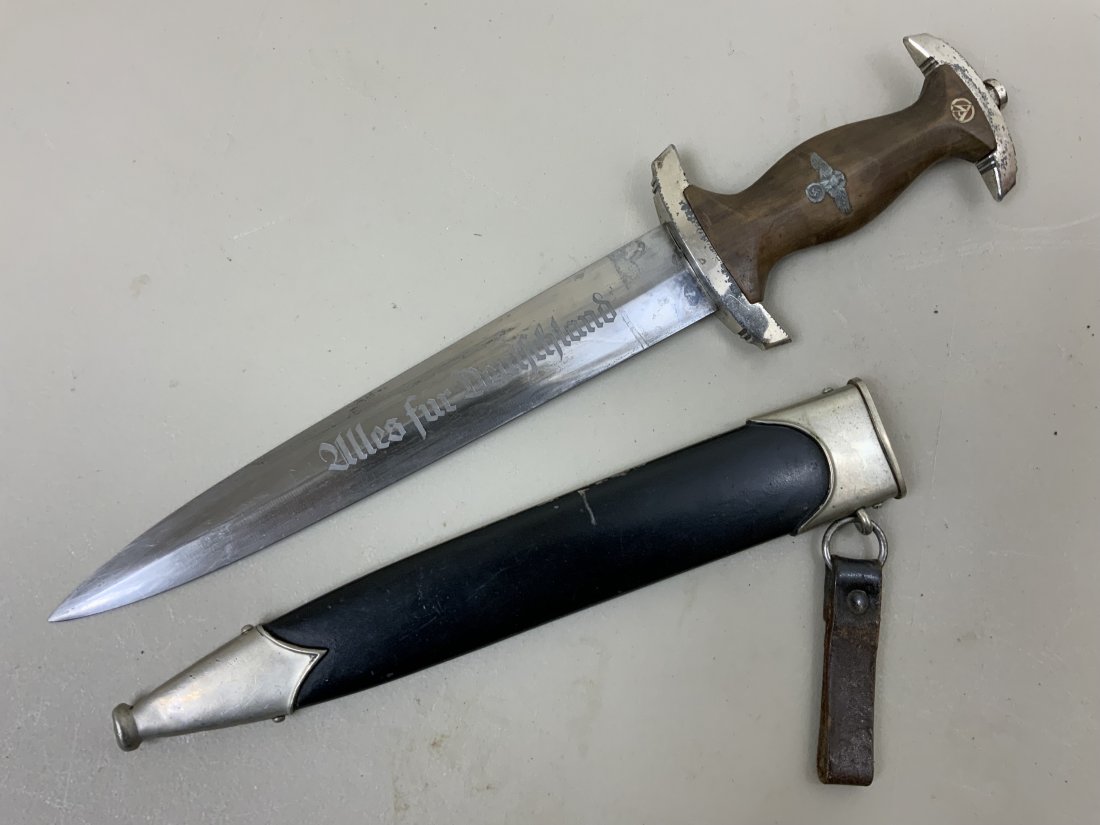 WWII NAZI GERMAN NSKK DAGGER RZM M7/37: WWII NAZI GERMAN NSKK DAGGER RZM M7/37 . SOME WEAR TO GRIP FITTINGS AND BLADE BUT STILL IN GOOD CONDITION DAGGER . COMPLETE WITH LEATHER BELT LOOP.