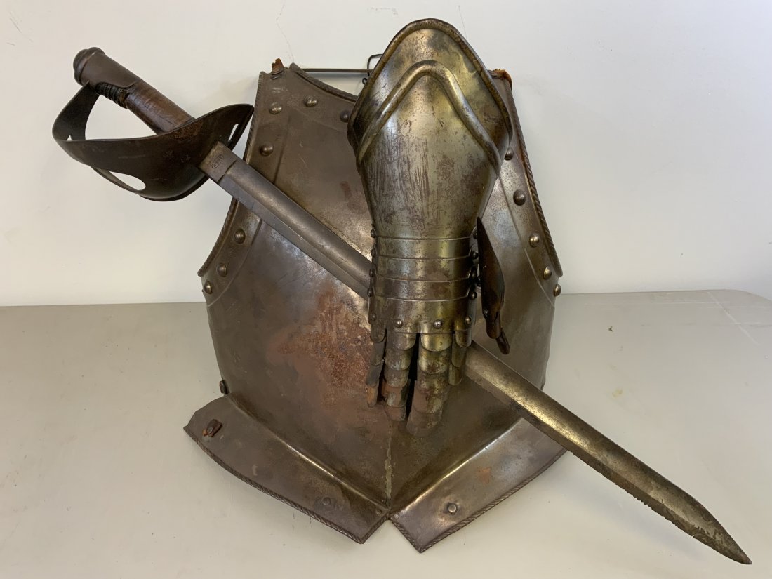MEDIEVAL STYLE WALL DECORATING ARTWORK SWORD ARMOR: ANTIQUE MEDIEVAL STYLE WALL DECORATING ARTWORK. ANTIQUE CHEST ARMOR PLATE WITH REMNANTS OF LEATHER BELT STRAPS SHOWS A GREAT AGE . ANTIQUE SWORD AND GAUNTLET ATTACHED TO THE FRONT. LATE 19th CENTURY P