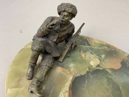 ANTIQUE IMPERIAL RUSSIAN STONE BASE BRONZE HUNTER ASH: ANTIQUE IMPERIAL RUSSIAN STONE BASE BRONZE HUNTER ASHTRAY. BRONZE HUNTER SMOKING A PIPE RESTING ON ITS ONYX STONE BASE.BEAUTIFUL CRAFTSMANSHIP . HEAVY 5 LBS. SIZE 9 X 7 X 4 .