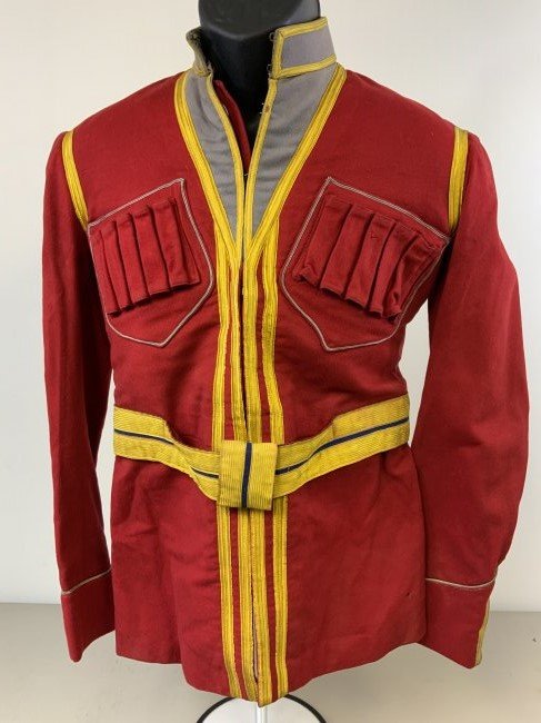 IMPERIAL RUSSIAN COSSACK OFFICER DRESS UNIFORM TUNIC: IMPERIAL RUSSIAN COSSACK OFFICER DRESS UNIFORM TUNIC . WELL WORN INSIDE AND OUT WITH SOME HOLES AND SWEAT STAINS BUT STILL GOOD CONDITION . COMPLETE WITH ITS BELT. SMALL SIZE. RARE FIND AND WILL DISPL