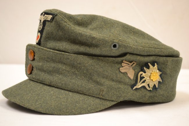 WWII GERMAN ARMY MOUNTAIN JAGER HAT Bergmutze FIELD CAP: WWII GERMAN ARMY MOUNTAIN JAGGER HAT Bergm?tze FIELD CAP . OUTSTANDING EXAMPLE. AUSTRIAN MADE WIENER MUTZEN LAGO 1943.SIZE 59 . NEAR MINT EXAMPLE. WOOD BUTTON FRONT. SHORT BILL. OFFICER QUALITY . FULL