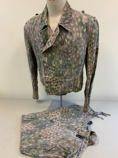 WWII GERMAN WAFFEN SS PANZER CAMOUFLAGE UNIFORM SET DOT: WWII GERMAN WAFFEN SS PANZER CAMOUFLAGE UNIFORM SET IN "DOT"PATTERN . VERY RARE SET M44 HBT CAMOUFLAGE PANZER JACKET WITH MATCHING PAIR OF M44 DRILL UNIFORM TROUSERS.WELL WORN CONDITION BUT WITH NO HO