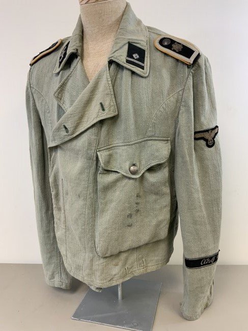 WWII GERMAN WAFFEN SS REED GREEN HBT ARMORED CREW JACKE: WWII GERMAN WAFFEN SS REED GREEN HBT ARMORED CREW JACKET . WELL WORN EXAMPLE ARMY STYLE REED GREEN HBT UTILITY ARMORED CREW FIELD JACKET WITH LARGE FRONT POCKET FOR THE WAFFEN SS DIVISION "ADOLF HITLE