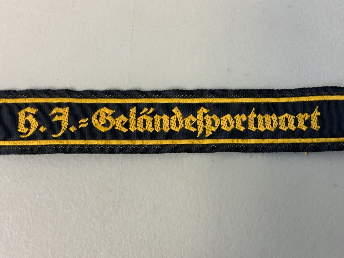 WWII GERMAN HITLER YOUT "HJ Gelandesportwart" CUFFTITLE: WW2 German Hitler Youth Gelandesportwart HJ Field Event Attendant Cuff Title. Cut from uniform.