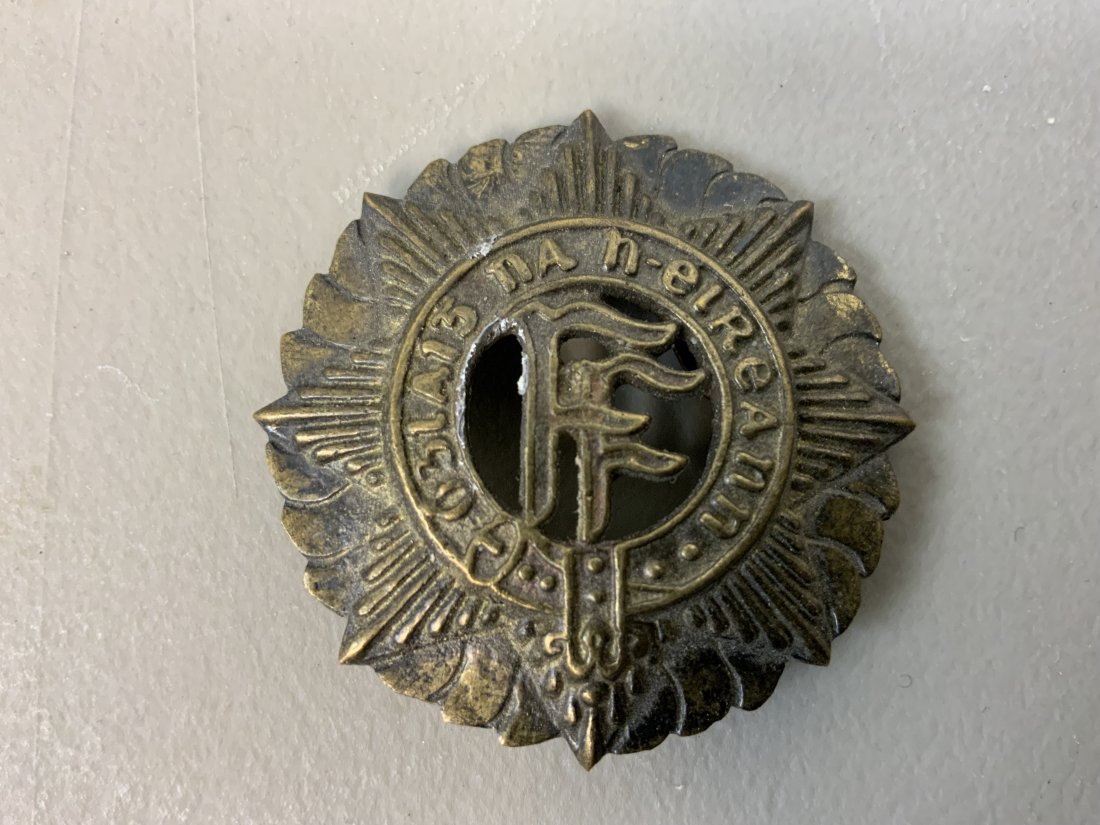IRISH ARMY M27 VICKERS HELMET BRASS BADGE: IRISH ARMY M27 VICKERS HELMET BRASS BADGE .