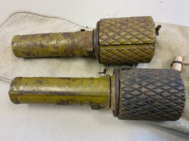 WWII SOVIET RUSSIAN RGD -33 PAIR OF INERT GRENADES: WWII SOVIET RUSSIAN RGD -33 PAIR OF INERT GRENADES IN POUCH .NICE PAIR WITH ORIGINAL PAINT AND MARKINGS COMPLETE WITH FRAGMENTATION SLEEVES . RARE .