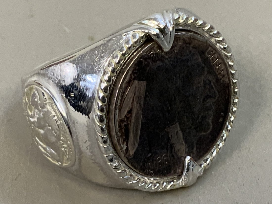 MENS INDIAN HEAD RING - STERLING SILVER: MEN'S INDIAN HEAD RING - STERLING SILVER . SIZE 14 . STAMPED INSIDE 925 BGE. INSCRIBED INSIDE "INDIAN NICKEL HONORING T. MERICAN WEST"