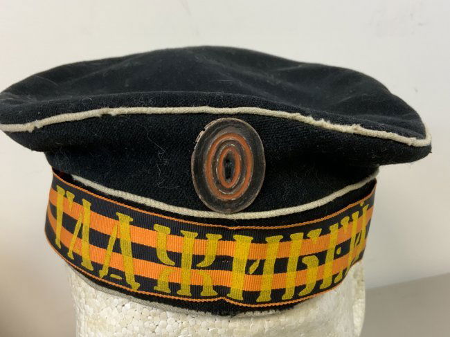WWI IMPERIAL RUSSIAN DONALD DUCK STYLE SAILOR CAP: WWI IMPERIAL RUSSIAN DONALD DUCK STYLE SAILOR CAP . APPEARS TO BE AN OLD REPRODUCTION POSSIBLE MOVIE OR THEATER USED. WELL WORN CONDITION WITH "HADJIBEI" BATTLESHIP CAP TALLY . SIZE ABOUT 55.