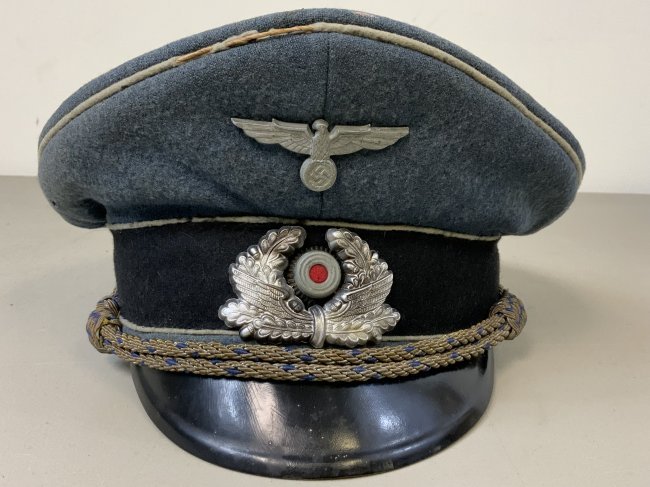WWII GERMAN RAILWAY POLICE Bahnschutzpolizei VISOR CAP: WWII GERMAN RAILWAY POLICE Bahnschutzpolizei VISOR CAP. WELL WORN CONDITION WITH SOME MOTH DAMAGE TO THE WOOL TOP AND PIPING. STILL NICE SHAPE AND QUITE RARE TO FIND .