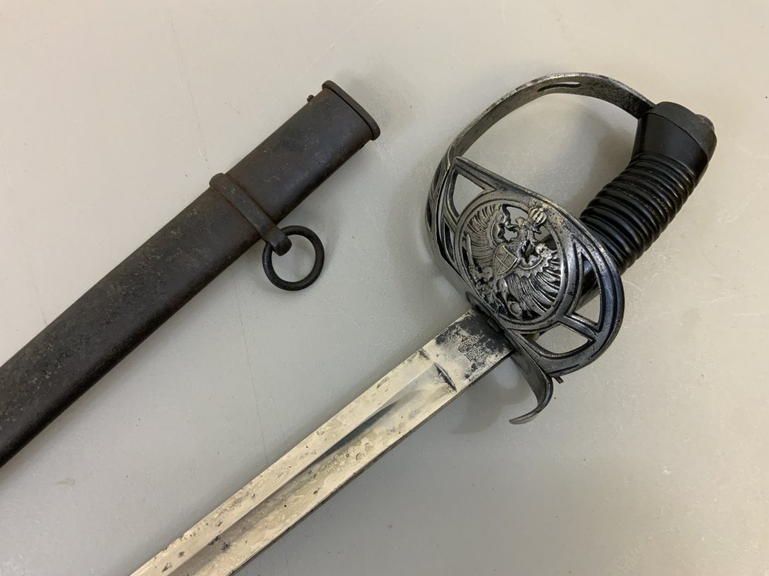 IMPERIAL GERMAN PRUSSIAN CAVALRY M1889 DAGGEN SWORD: IMPERIAL GERMAN PRUSSIAN CAVALRY M1889 DAGGEN SWORD . GOOD CONDITION OVERALL WITH W.K.&C. MARKED BLADE. DARK BROWN GRIP HAS REPAIR . FOLDING GUARD WITH PRUSSIAN EAGLE.