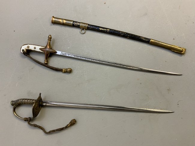 ANTIQUE MINIATURE SWORD AND SCABBARD LOT OF 2: ANTIQUE MINIATURE SWORD AND SCABBARD LOT OF 2 . 2 MINIATURE SWORDS TO INCLUDE USMC SWORD WITH NICE ETCHED BLADE AND ONE KUK AUSTRIAN SWORD SCABBARD . VERY HIGH QUALITY STUFF . THE SCABBARD DOES NOT FI