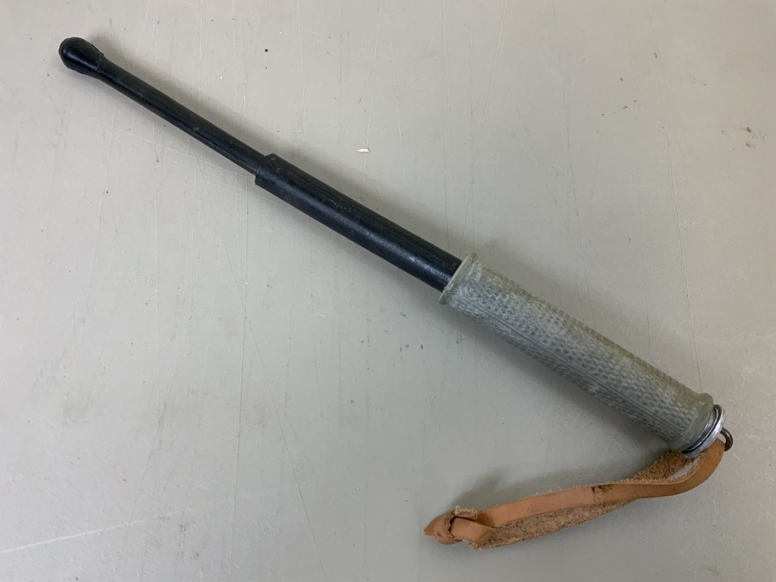 VINTAGE EAST GERMAN "STASI" COLLAPSIBLE NIGHT STICK: VINTAGE EAST GERMAN "STASI" COLLAPSIBLE NIGHT STICK . COLD WAR ERA. COMPLETE WITH LEATHER WRIST STRAP . 8" LONG EXTENDS TO 15" LONG .