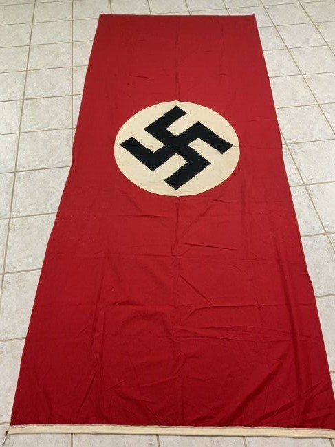 WWII GERMAN NAZI NSDAP NATIONAL FLAG BANNER DOUBLE SIDED: WWII GERMAN NAZI NSDAP NATIONAL FLAG BANNER . LARGE SIZE 113" LONG AND 48" WIDE (ABOUT 4FT X 9FT). DOUBLE SIDED. GREAT CONDITION WITH NO HOLES OR DAMAGES. MULTI PIECE CONSTRUCTION . MANUFACTURING LABE