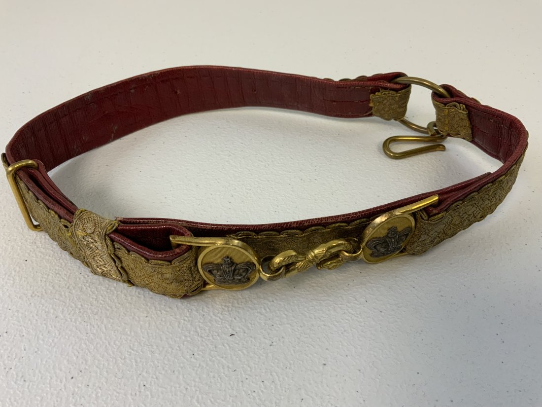 ANTIQUE BRITISH VICTORIAN OFFICERS DRESS SWORD BELT: ANTIQUE BRITISH VICTORIAN SWORD BELT. BEAUTIFUL HIGH QUALITY WITH BRASS BUCKLES WITH CROWNS . GOLD BROCADE WITH RED LEATHER BACK. SMALL SIZE . RARE .
