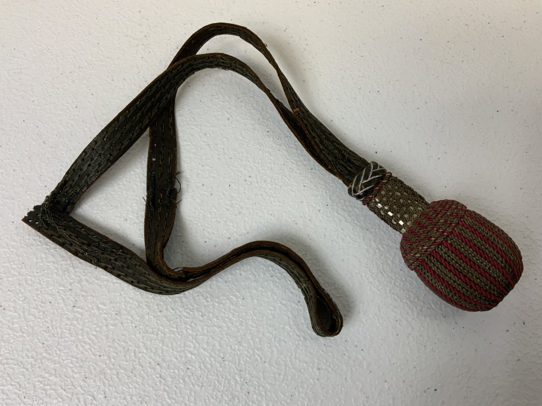 WWII GERMAN BAYONET SWORD KNOT PORTEPEE: WWII GERMAN BAYONET SWORD KNOT PORTEPEE. WELL USED CONDITION WITH SOME TEARS TO THE STRAP .
