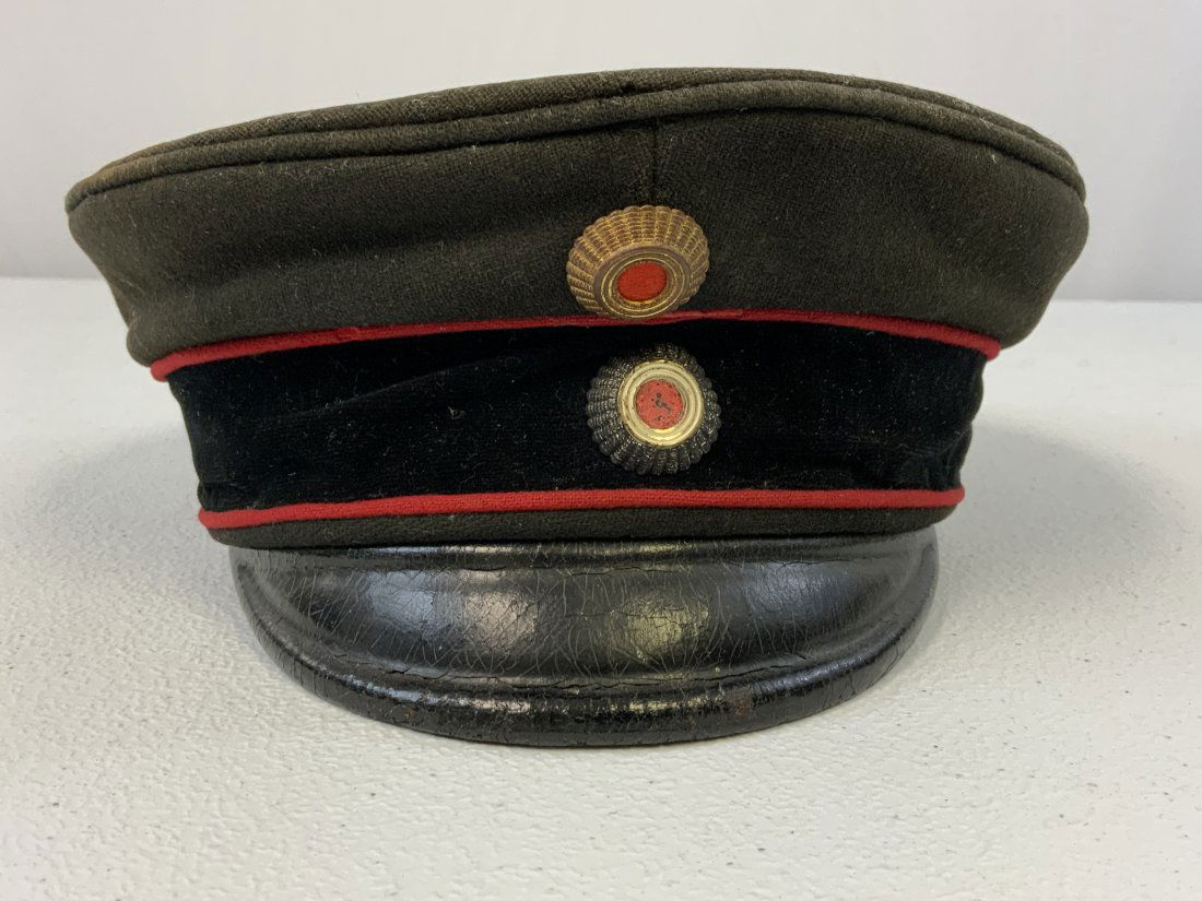 ANTIQUE IMPERIAL GERMAN OFFICERS VISOR CAP: ANTIQUE IMPERIAL GERMAN OFFICERS VISOR CAP . OLD PRE WWI AROUND LATE 19th CENTURY CAP . BLACK WOOL WITH RED COLOR LINING. MAKER MARKED. LEATHER VISOR. RARE TO FIND IN THIS GREAT CONDITION FOR ITS AGE