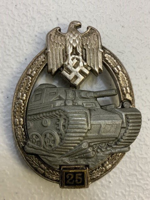 WWII GERMAN PANZER ASSAULT BADGE IN SILVER 25 ENGAGEMENTS BY JFS: WWII GERMAN PANZER ASSAULT BADGE IN SILVER 25 ENGAGEMENTS BY JFS. ZINK BASE WITH SILVERED WREATH AND PAINATED TANK. GREAT CONDITION WITH MOST OF THE FINISH INTACT.