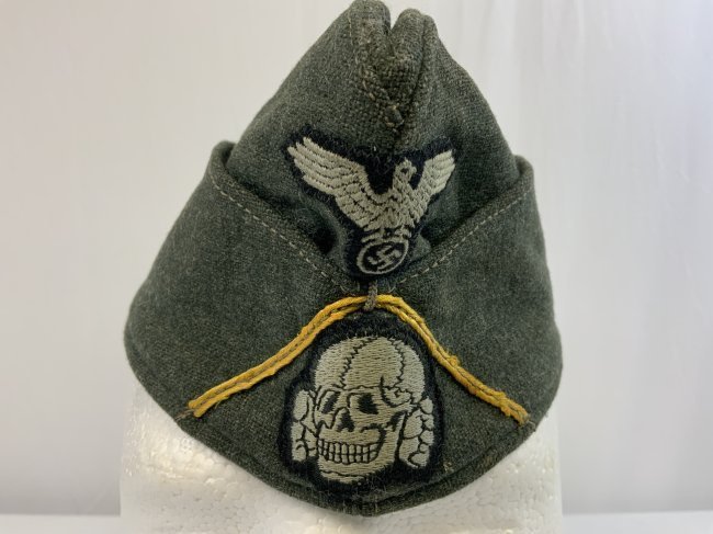 WWII GERMAN WAFFEN SS CAVALRY NCO FIELD CAP: WWII GERMAN WAFFEN SS CAVALRY NCO FIELD CAP . RARE EARLY EXAMPLE. FIELD GRAY M 1940 STANDARD ISSUE FIELD CAP WITH GOLDEN YELLOW SOUTACHE FOR CAVALRY TROOPS.GRAY RAYON LINING WITH INK STAMPED 54 FOR SI