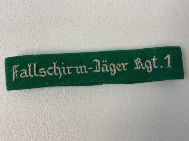 WWII GERMAN LUFTWAFFE PARATROOPER "fallschirm-jager Rgt. 1" CUFFTITLE: WWII GERMAN LUFTWAFFE PARATROOPER "fallschirm-jager Rgt. 1" CUFFTITLE. WHITE TREAD EMBROIDERY . GREAT CONDITION. 17" LONG