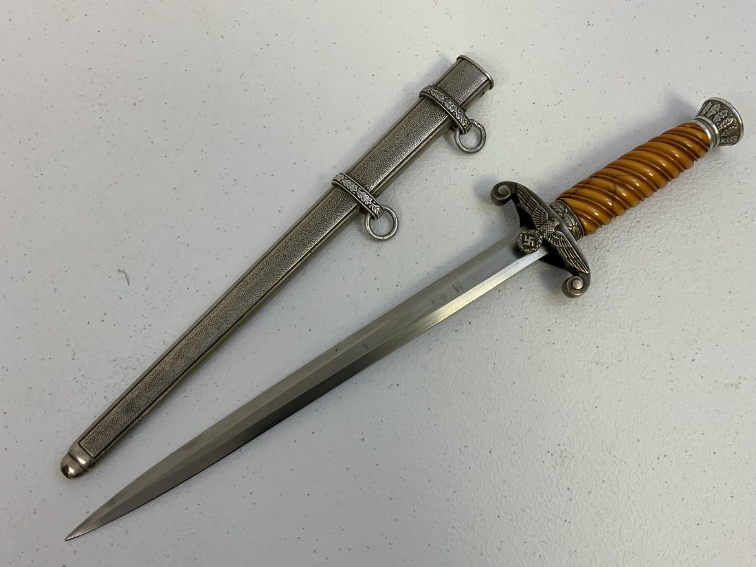 WWII GERMAN ARMY OFFICERS DRESS DAGGER SMF SOLINGEN: WWII GERMAN ARMY OFFICERS DRESS DAGGER . SNF SOLINGEN MARKED BLADE . NICE AND BRIGHT BLADE. GOOD DAGGER WITH SOME CRACKS IN YELLOW GRIP.