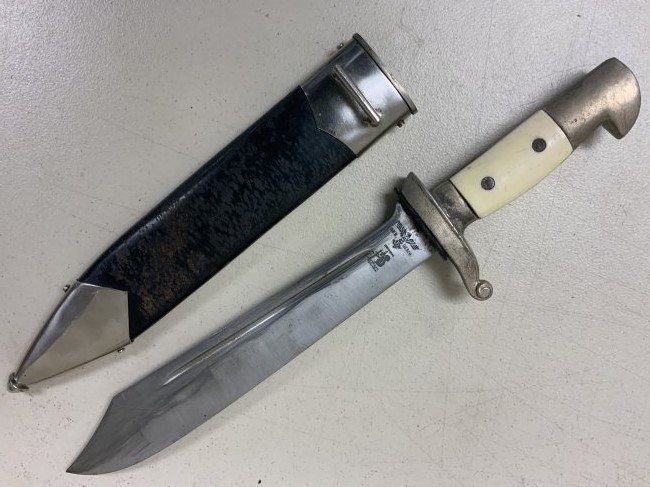 WWII GERMAN TENO HEWER DAGGER CARL EICKHORN STAMPED: WWII GERMAN TENO HEWER DAGGER BY CARL EICKHORN . PARTS DAGGER. MADE FROM LOOKS LIKE ORIGINAL SCABBARD WITH NUMBERED UPPER FITTING AND ORIGINAL BLACK PAINT WITH NORMAL WEAR AND AGE. THE DAGGER ITSELF I