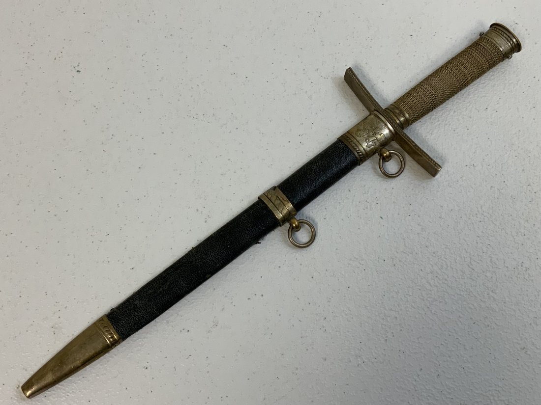 WWII GERMAN REICH HITLER YOUTH LEADER DAGGER: WWII GERMAN REICH HITLER YOUTH LEADER DAGGER . POSTWAR PIECE . GOOD CONDITION WITH WEAR AND AGE SHOWING . MOTTO ON THE BLADE AND MARKED RZM M7/37 . LEATHER COVERED SCABBARD. HIGH QUALITY MADE . GOOD F