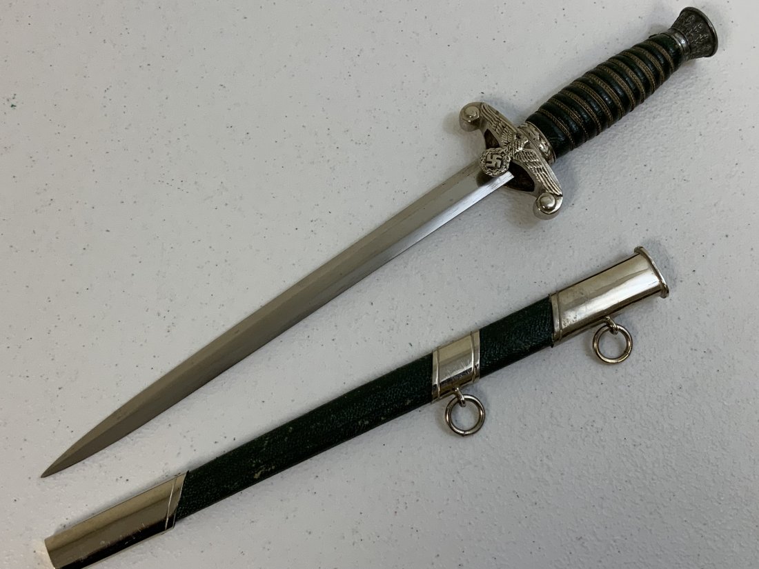WWII GERMAN REICH LAND CUSTOMS OFFICIAL DAGGER: WWII GERMAN REICH LAND CUSTOMS OFFICIAL DAGGER . POSTWAR PIECE . GOOD CONDITION WITH NICE GREEN COLOR LEATHER WRAPPED GRIP AND SCABBARD . NICKEL PLATED FITTINGS. VERY HIGH QUALITY MADE . GOOD FILLER F