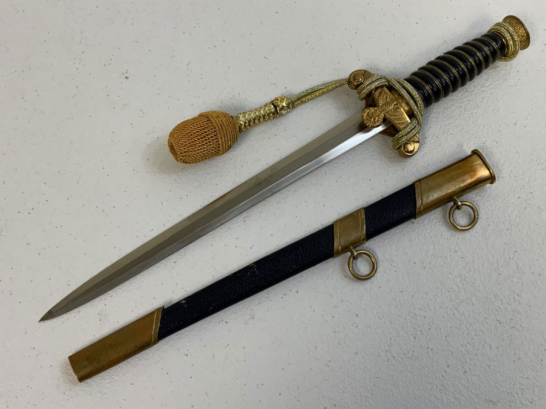 WWII GERMAN REICH WATER CUSTOMS OFFICIAL DAGGER: WWII GERMAN REICH WATER CUSTOMS OFFICIAL DAGGER . POSTWAR MADE COPY OF THIS EXTRA RARE DAGGER . GOOD CONDITION WITH NICE BLUE COLOR LEATHER WRAPPED GRIP AND SCABBARD . GILDED FITTINGS AND GOLD THREAD