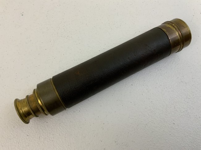 ANTIQUE NAUTICAL BRASS TELESCOPE SPYGLASS: ANTIQUE NAUTICAL BRASS TELESCOPE SPYGLASS . MID 19th CENTURY . GREAT CONDITION FOR ITS AGE. OPTICS IS NICE AND CLEAR. ORIGINAL LEATHER WRAP. 9.5" COLLAPSED AND EXTENDS TO 29" LONG. NICE EXAMPLE.