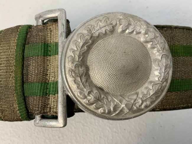 WWII GERMAN FORESTRY HUNTING OFFICER BROCADE BELT AND BUCKLE: WWII GERMAN FORESTRY HUNTING OFFICER BROCADE BELT AND BUCKLE. PLAIN ALUMINUM OFFICERS ROUND BUCKLE. NICE RARE BROCADE BELT. GREAT CONDITION.