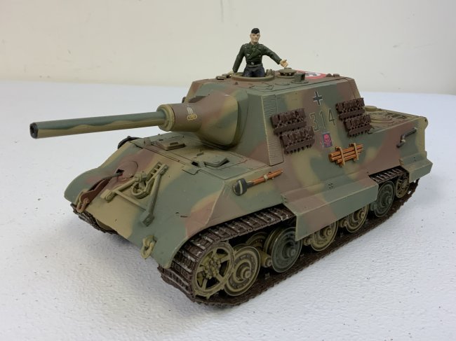 WWII GERMAN JAGTIGER TANK DESTROYER IN LATE WAR CAMMO PAINT METAL 1:32 MODEL DETAILED: WWII GERMAN JAGTIGER TANK DESTROYER IN LATE WAR CAMMO PAINT METAL 1:32 MODEL. HIGHLY DETAILED . GREAT DISPLAY PIECE . 9" LONG BODY , 10" TOTAL LENGTH WITH BARREL .