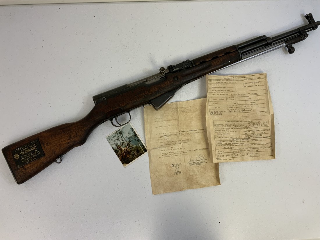 CHINESE TYPE 56 SKS RIFLE VIETNAM WAR VET BRING BACK NVA TROPHY GUN: CHINESE TYPE 56 SKS RIFLE VIETNAM WAR VET BRING BACK NVA TROPHY GUN. COMPLETE WITH U.S. MILITARY BRING BACK PAPERS AND A PHOTOGRAPH. THE STOCK ALSO DISPLAYS A PRESENTATION PLAQUE PRESENTED TO INTELLIG
