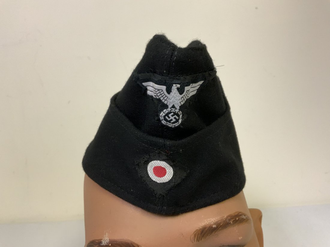 WWII GERMAN PANZER OVERSEAS REENACTMENT CAP: WWII GERMAN PANZER OVERSEAS REENACTMENT CAP. BLACK WOOL BODY WITH CORRECT INSIGNIA SEWN . ALL POSTWAR MADE FOR REENACTMENT . SIZE ABOUT 57