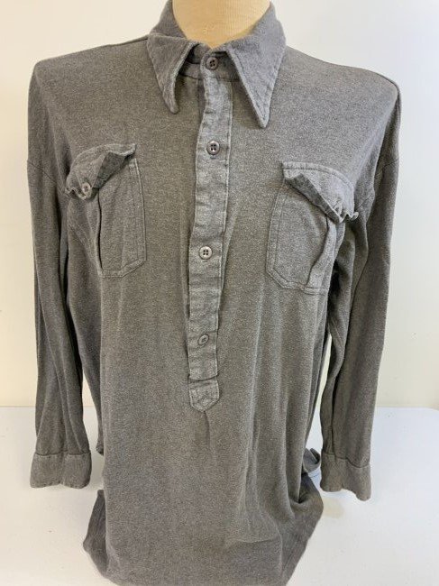 WWII GERMAN ARMY GRAY WOOL UNDERSHIRT: WWII GERMAN ARMY GRAY WOOL UNDERSHIRT . VERY RARE TO FIND. GREAT CONDITION OVERALL . COMPLETE WITH ALL BUTTONS . NICE LARGE SIZE ALSO