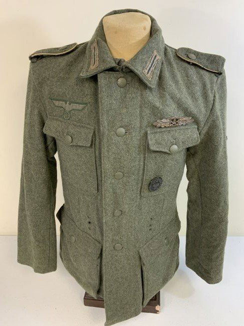 WWII GERMAN ARMY WOOL M42 UNIFORM TUNIC MOVIE USED " SAVING PRIVATE RYAN" 1998: WWII GERMAN ARMY WOOL M42 UNIFORM TUNIC . CONSIGNOR STATES THIS UNIFORM WAS MOVIE USED IN " SAVING PRIVATE RYAN" 1998 BY STEVEN SPIELBERG PARAMOUNT PICTURES. NICE USED CONDITION. LARGE SIZE .NAMED INS