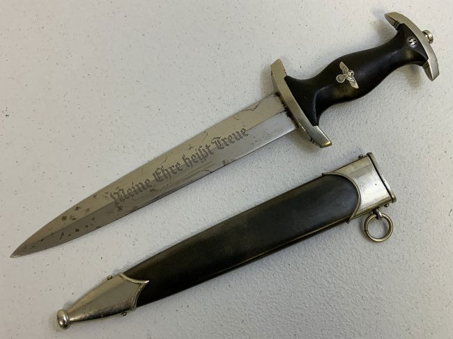 THIRD REICH GERMANY M33 SS DAGGER EICKHORN HIMMLER INSCRIBED: THIRD REICH GERMANY M33 SS DAGGER EICKHORN HIMMLER INSCRIBED . GREAT LOOKING EARLY QUALITY DAGGER . APPEARS TO BE A PARTS DAGGER . IN OUR OPINION THIS ONE MADE FROM ORIGINAL FITTINGS AND SCABBARD AND