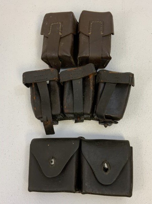 ANTIQUE SWISS / GERMAN / RUSSIAN LOT OF 3 AMMUNITION LEATHER POUCHES: ANTIQUE SWISS / GERMAN / RUSSIAN LOT OF 3 AMMUNITION LEATHER POUCHES. WWI DATED GERMAN 3 POCKET POUCH WITH 2 OF THE 3 COVERS SEPARATED. SWISS POUCH NICELY MARKED AND IN VERY GOOD CONDITION . RUSSIAN B